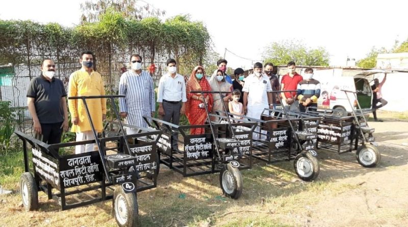 jhansi MLA donated vehicles for wood transportation in Muktidham